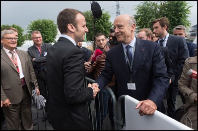 French Minister of Economy, Industry and the Digital Sector, Emmanuel Macron and Alain Juppe. Former French Prime Minister and presidential candidate of the opposition Republicans (Les Republicains, or LR) for the French presidental elections in 2017, Alain Juppe visits the Eurosatory 2016 defence and security international exhibition. Villepinte, FRANCE-16/06/2016