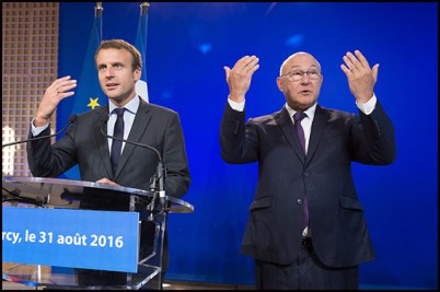 Emmanuel Macron and Michel Sapin. France's former Minister of the Economy Emmanuel Macron speaks as he hands over power to French Minister of Finance and also current Minister of Economy Michel Sapin. Paris, FRANCE-31/08/2016