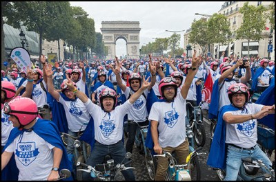 1000 entrepreneurs from Vendee drive on the Champs Elysee and near the Eiffel Tower during the 2016 "Grand prix meule bleue" on their old blue mopeds. This competition is intended to highlight the dynamism of the companies of Vendee Paris, France 10/09/2016