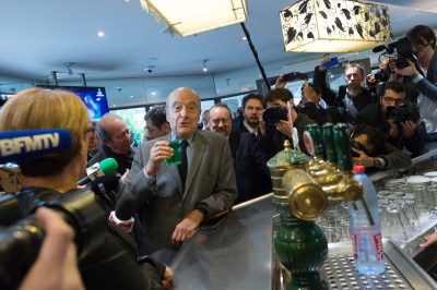 Alain Juppe in a cafe drink a menthe a l'eau. French former prime minister Alain Juppe and candidate for France's conservative presidential primary (LR) and Patrick Devedjian visiting La Defense. Paris La Defense, FRANCE-25/10/2016