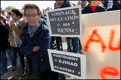 People during a demonstration against the first Center for Prevention, Integration and Citizenship (CPIC). Beaumont-en-Veron, FRANCE-22/10/2016